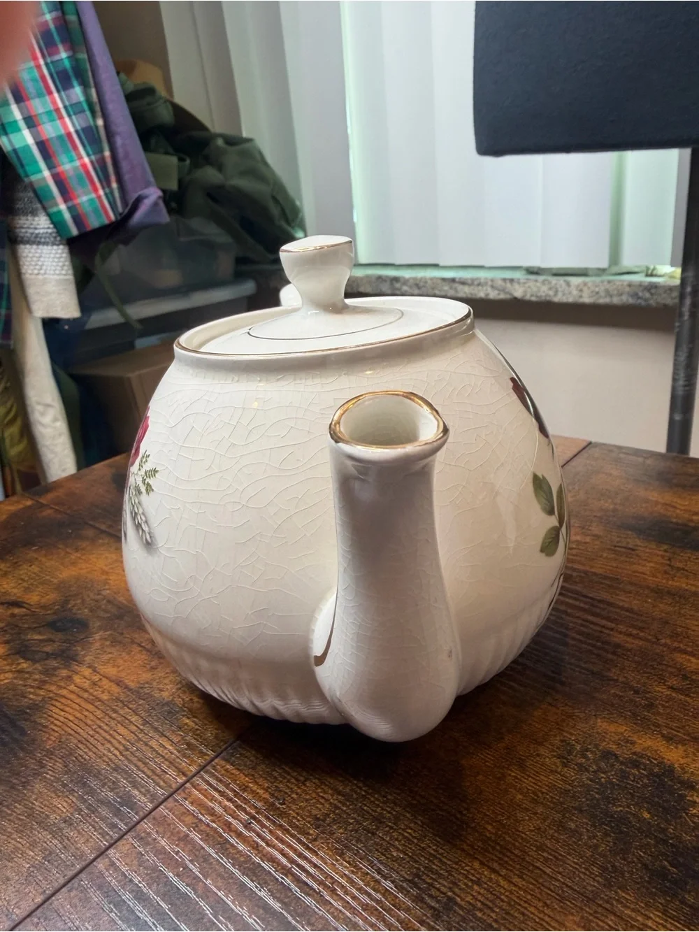 Vintage Ellgreave England red rose teapot featuring delicate gold trim.